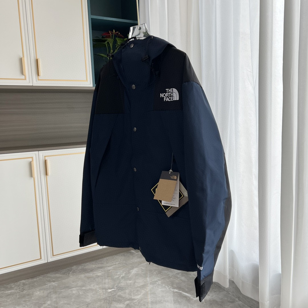 The North Face GORE-TEX Waterproof Hooded Mountain Jacket, Navy Blue and Black Colorblock Outdoor Windbreaker
