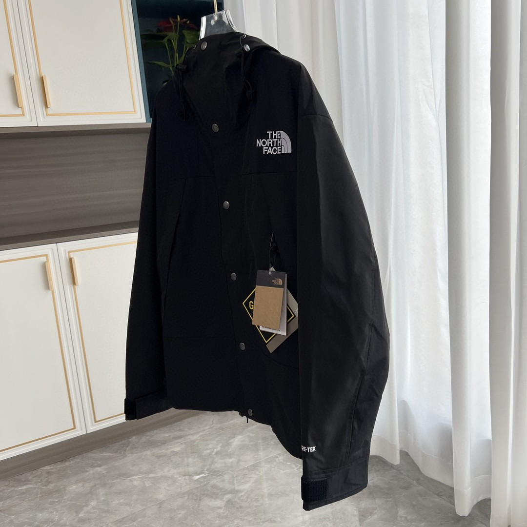 The North Face GORE-TEX Waterproof Hooded Mountain Jacket, All Black Outdoor Windbreaker with Embroidered Logo