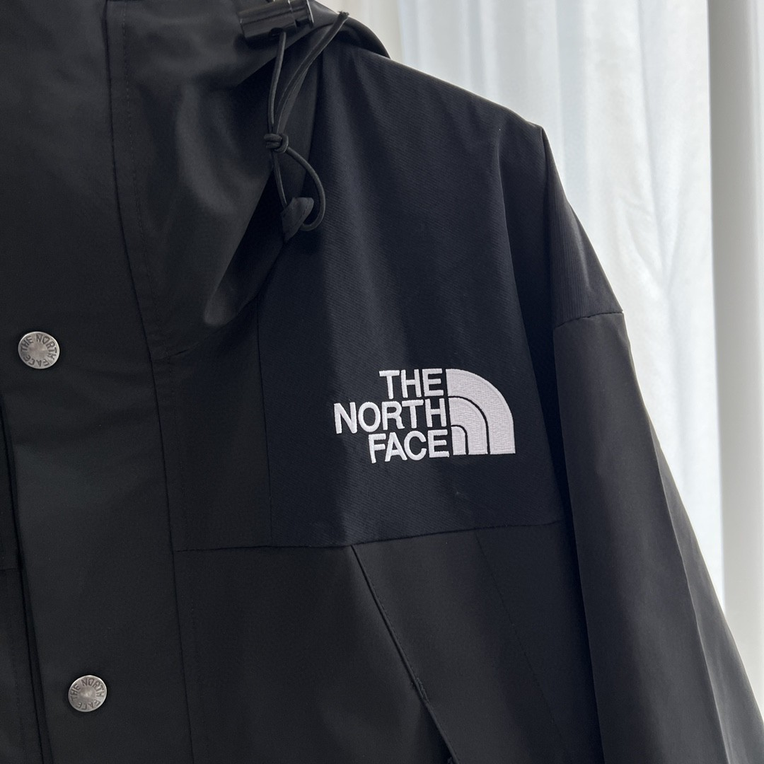 The North Face GORE-TEX Waterproof Hooded Mountain Jacket, All Black Outdoor Windbreaker with Embroidered Logo