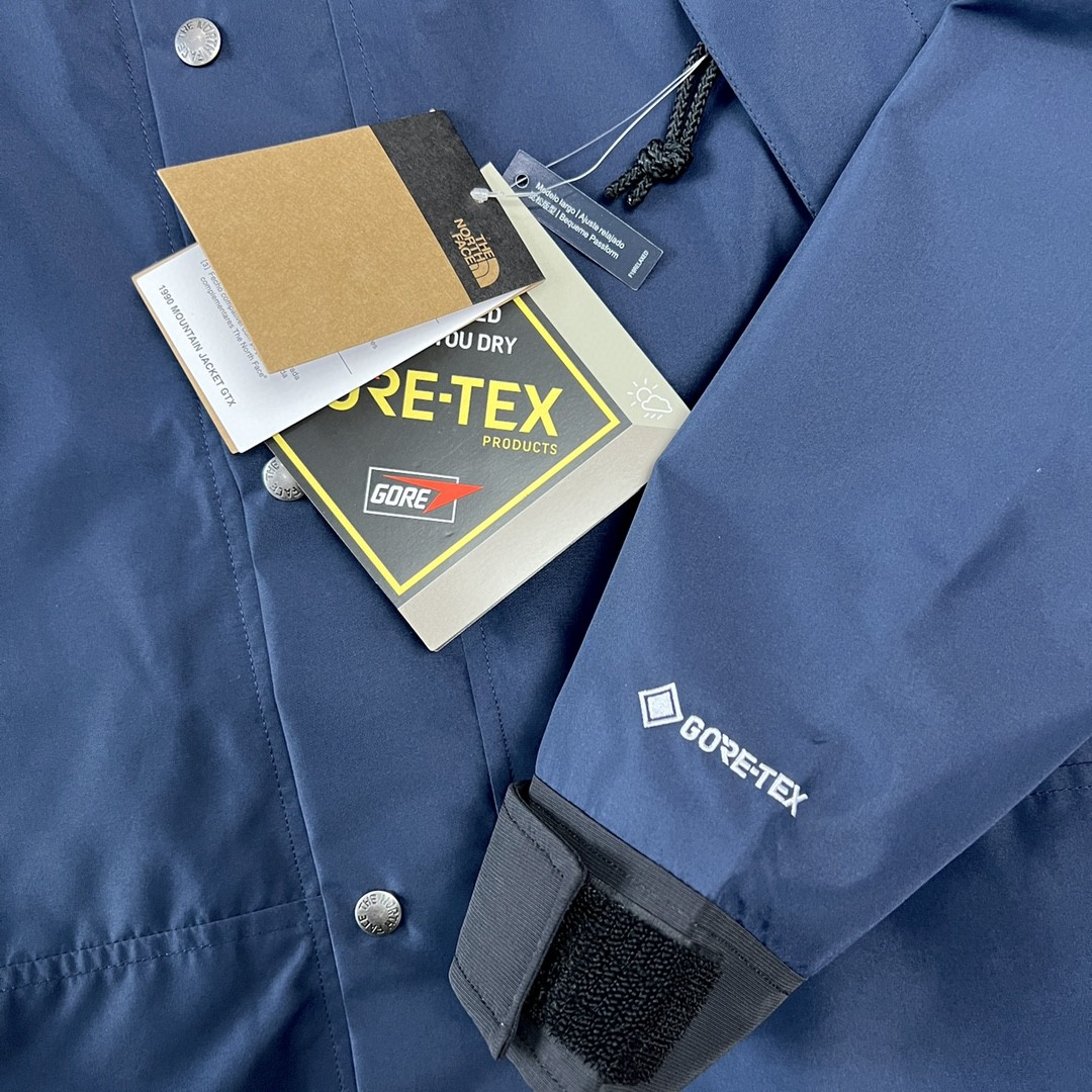 The North Face GORE-TEX Waterproof Hooded Mountain Jacket, Navy Blue and Black Colorblock Outdoor Windbreaker