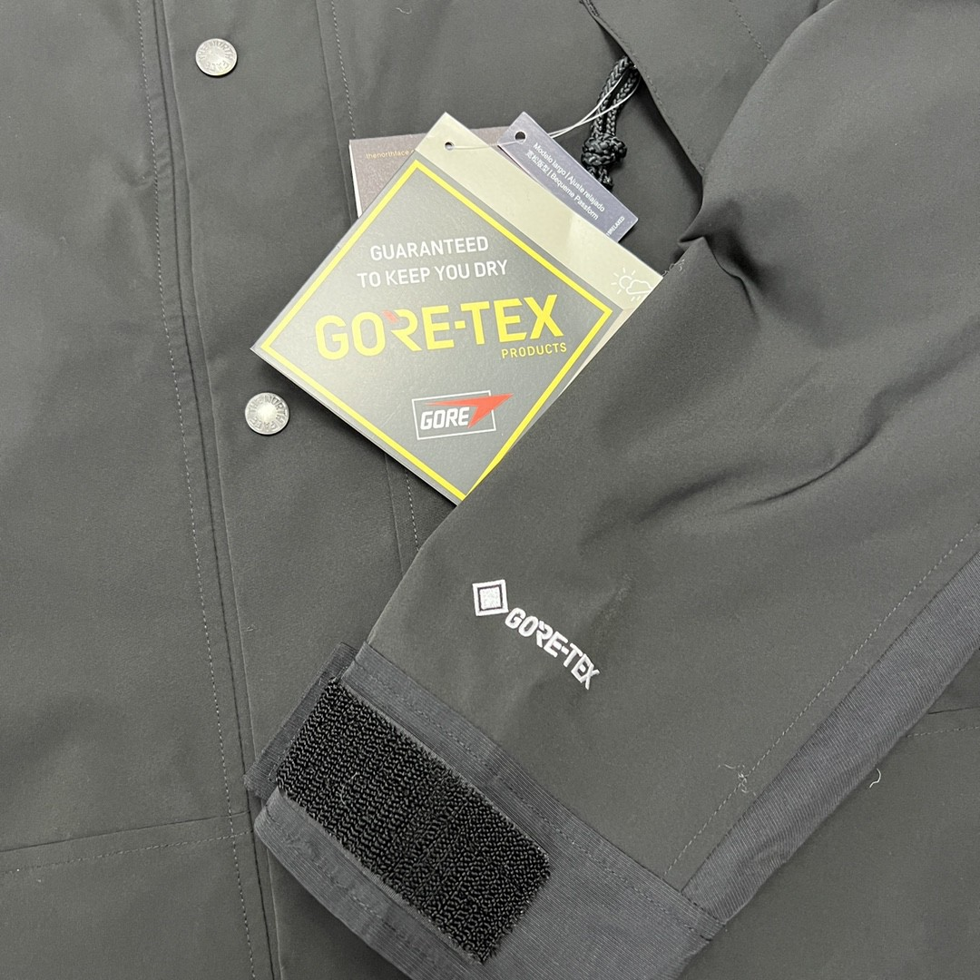 The North Face GORE-TEX Waterproof Hooded Mountain Jacket, All Black Outdoor Windbreaker with Embroidered Logo