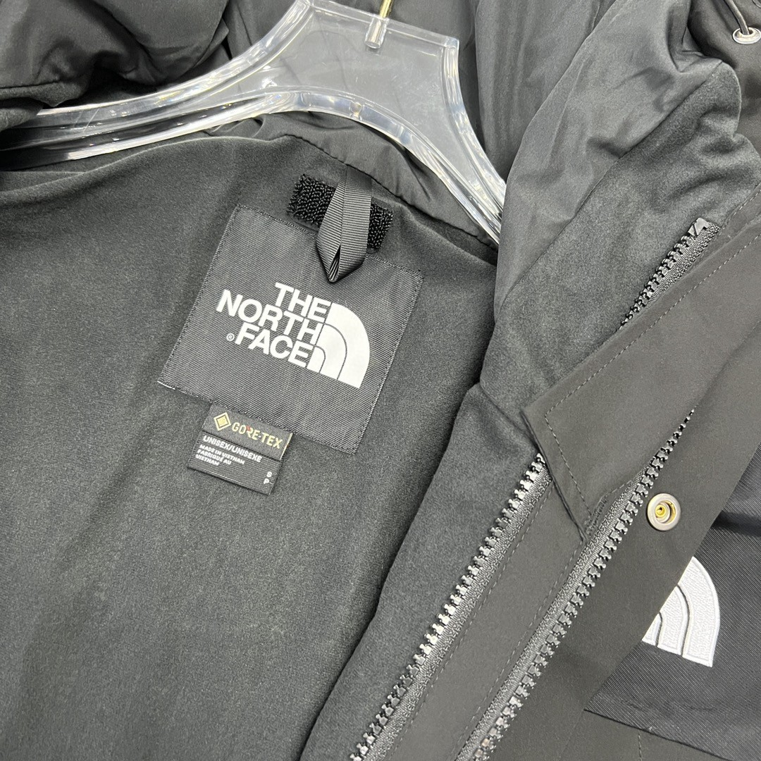 The North Face GORE-TEX Waterproof Hooded Mountain Jacket, All Black Outdoor Windbreaker with Embroidered Logo