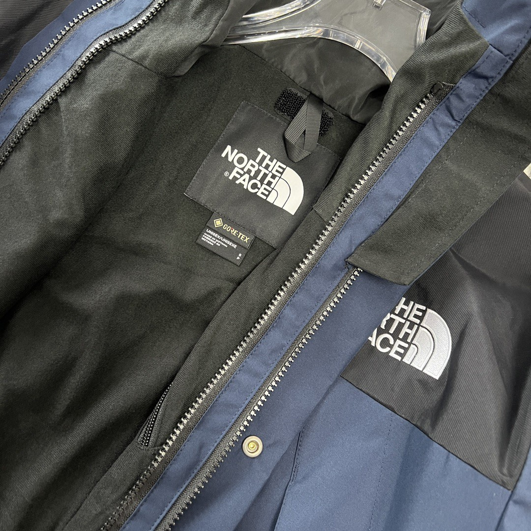 The North Face GORE-TEX Waterproof Hooded Mountain Jacket, Navy Blue and Black Colorblock Outdoor Windbreaker